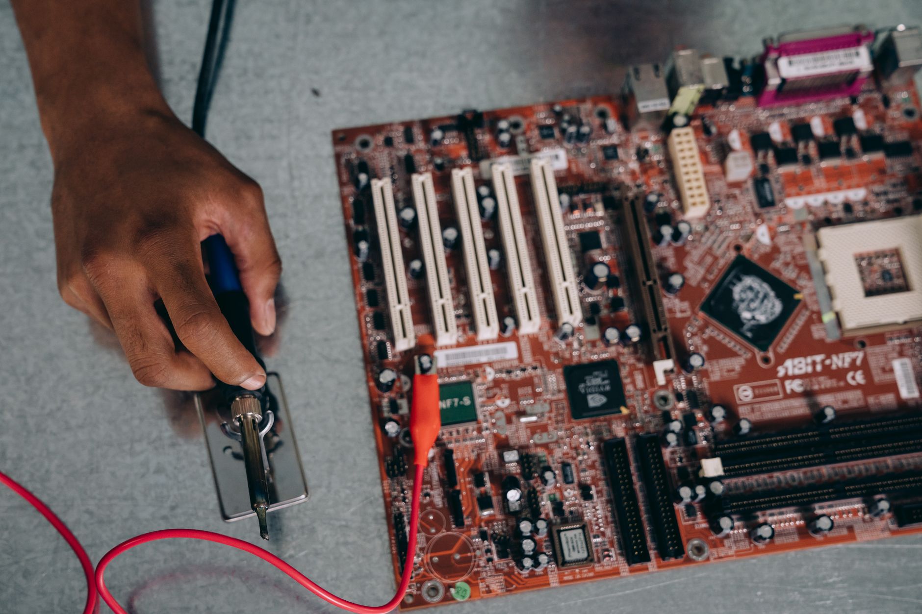 person working on a motherboard